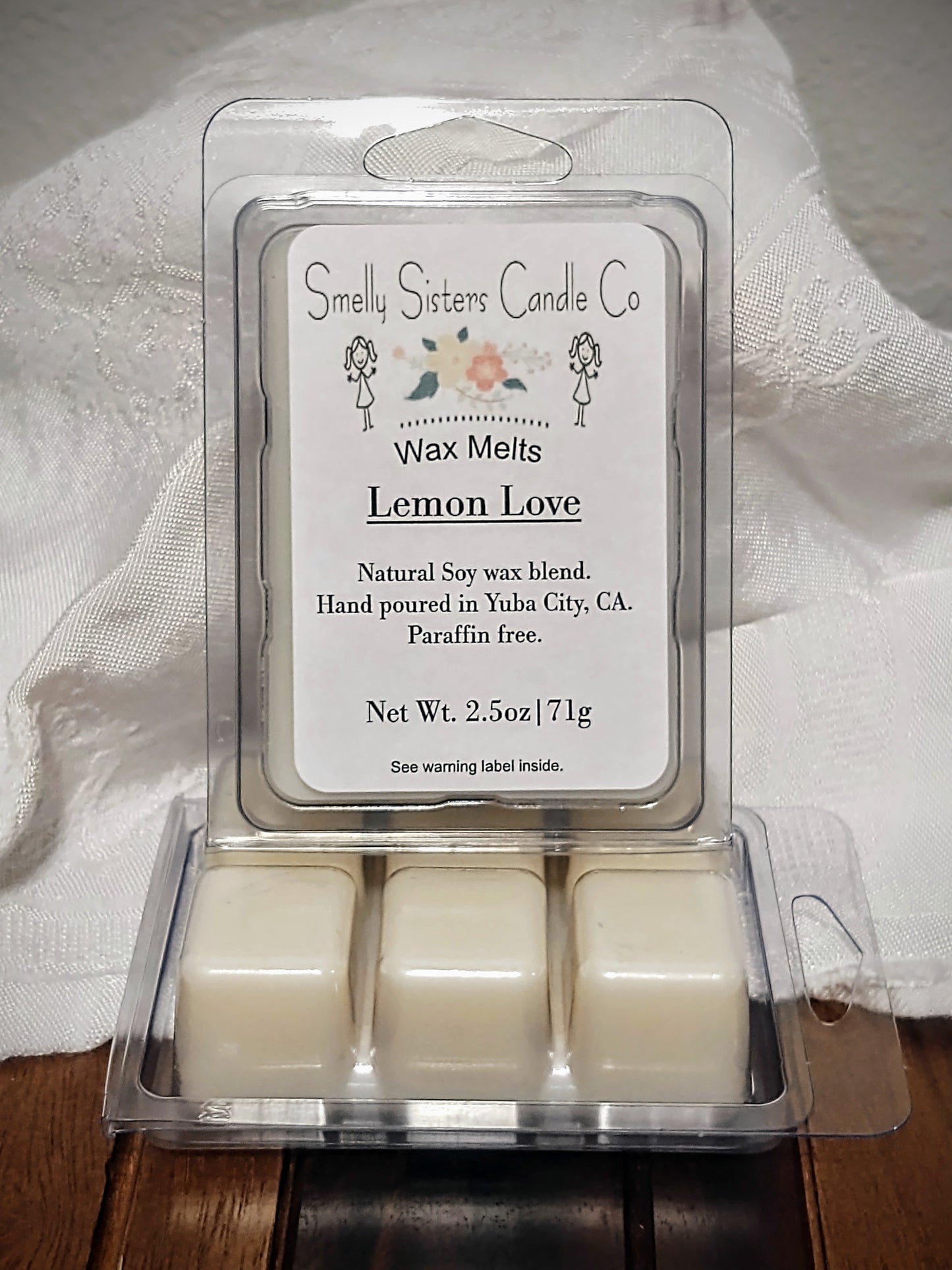 Soy wax melts in a plastic clam shell container scented lemon and cake. Dye free. Paraffin free. Highly fragranced with fragrance oils infused with essential oils.
