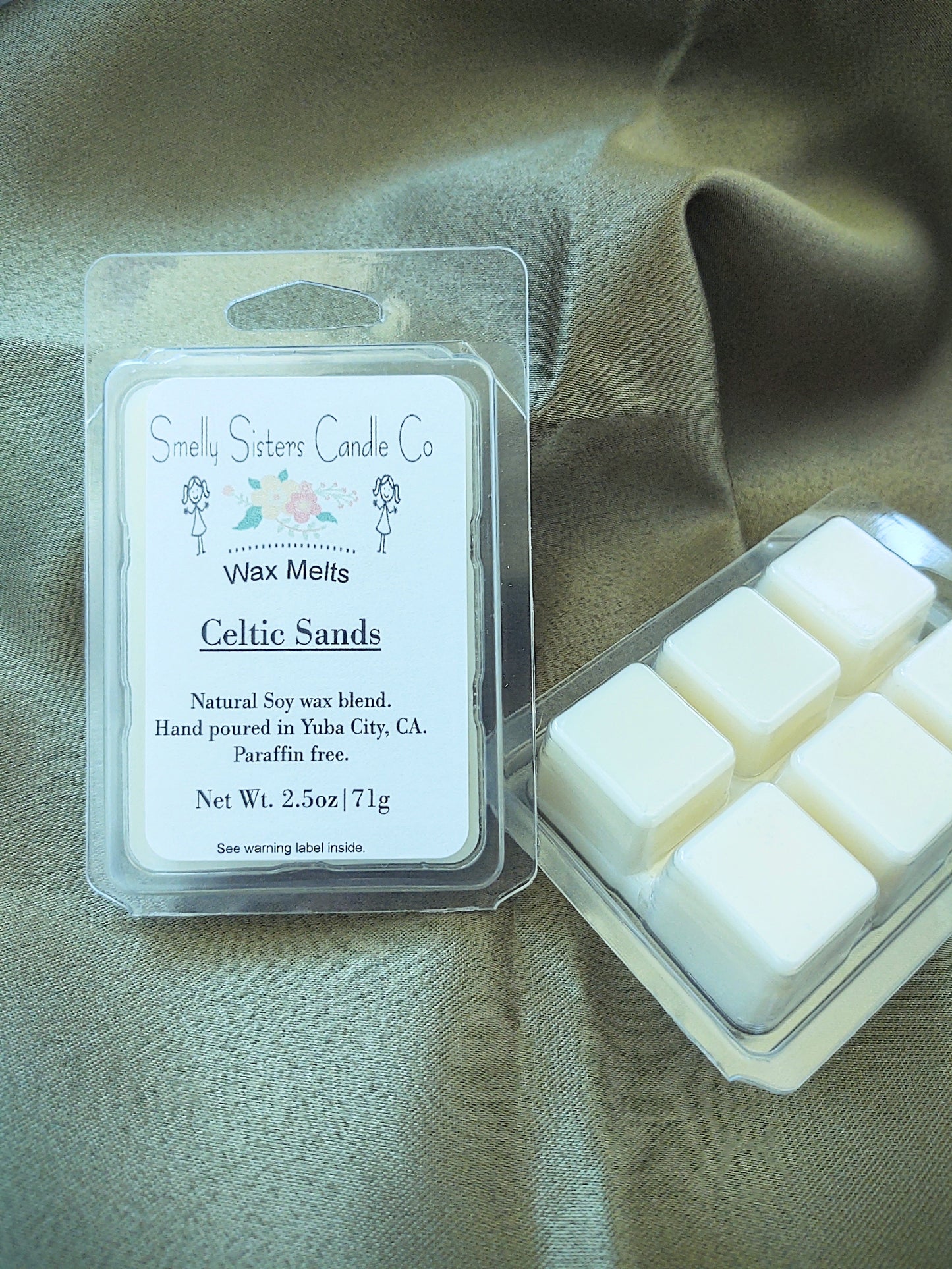 A clear plastic clamshell packaging containing dye free wax tarts made with soy and beeswax wax. High quality fragrance oils.