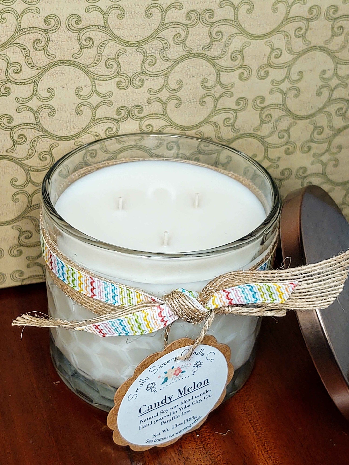 A large 3-wick scented soy candle. Fruity and sweet melon scented.