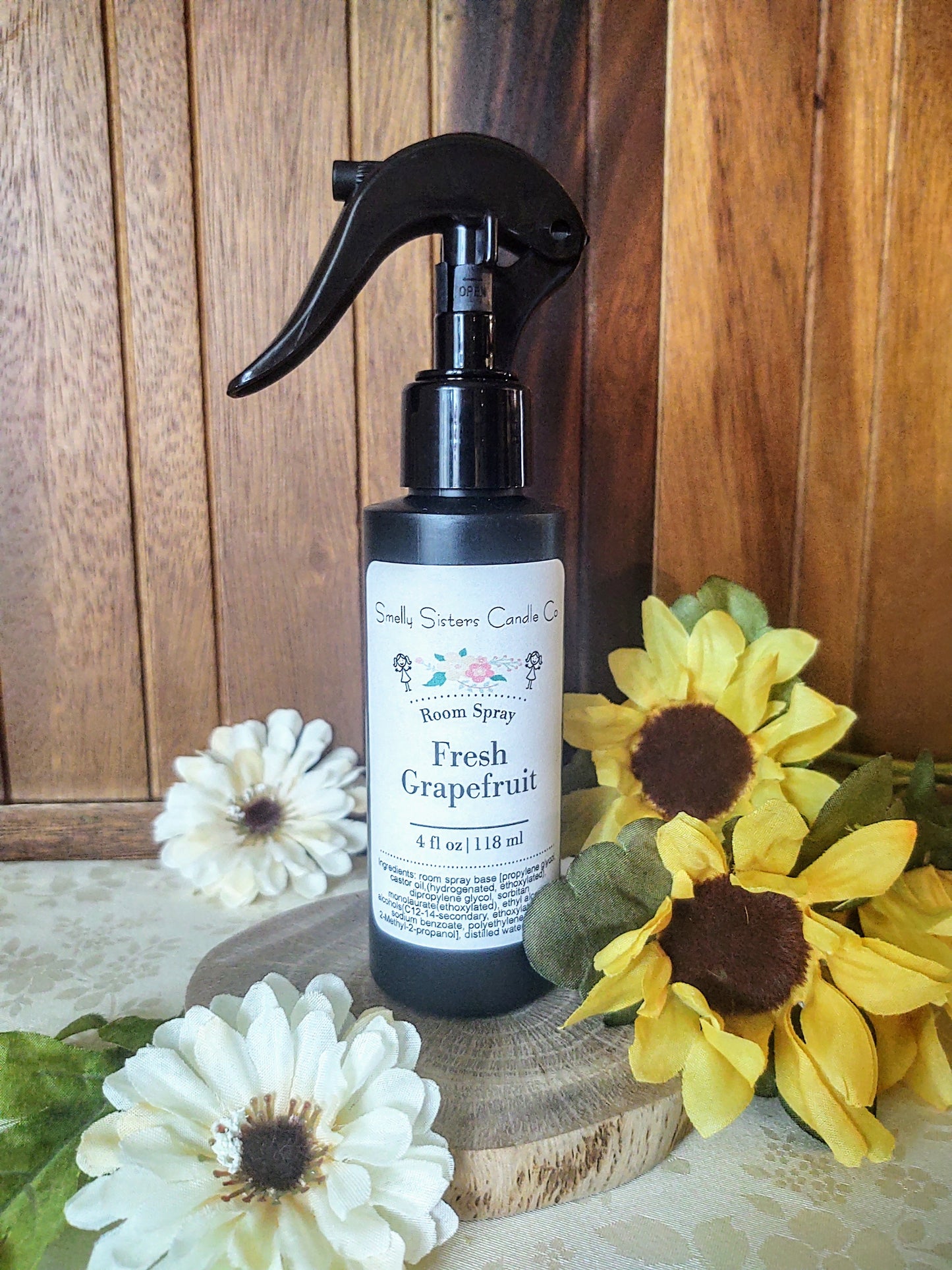 A black plastic bottle with a fine mist spray nozzle. Fresh grapefruit scented room spray. Phthalate free fragrances.