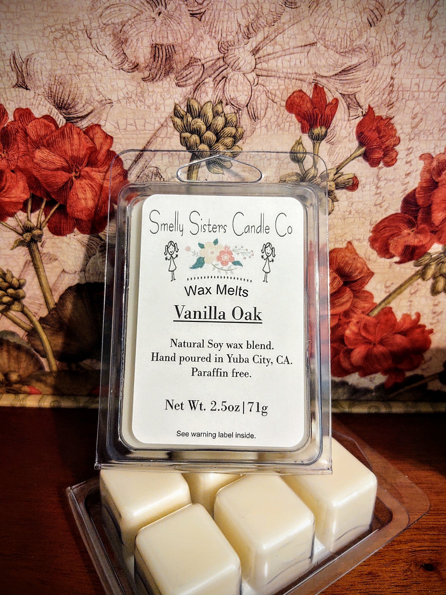 A clear plastic clamshell packaging containing Dye free vanilla oak soy wax melts. Paraffin free, phthalate free, cleaner burning.
