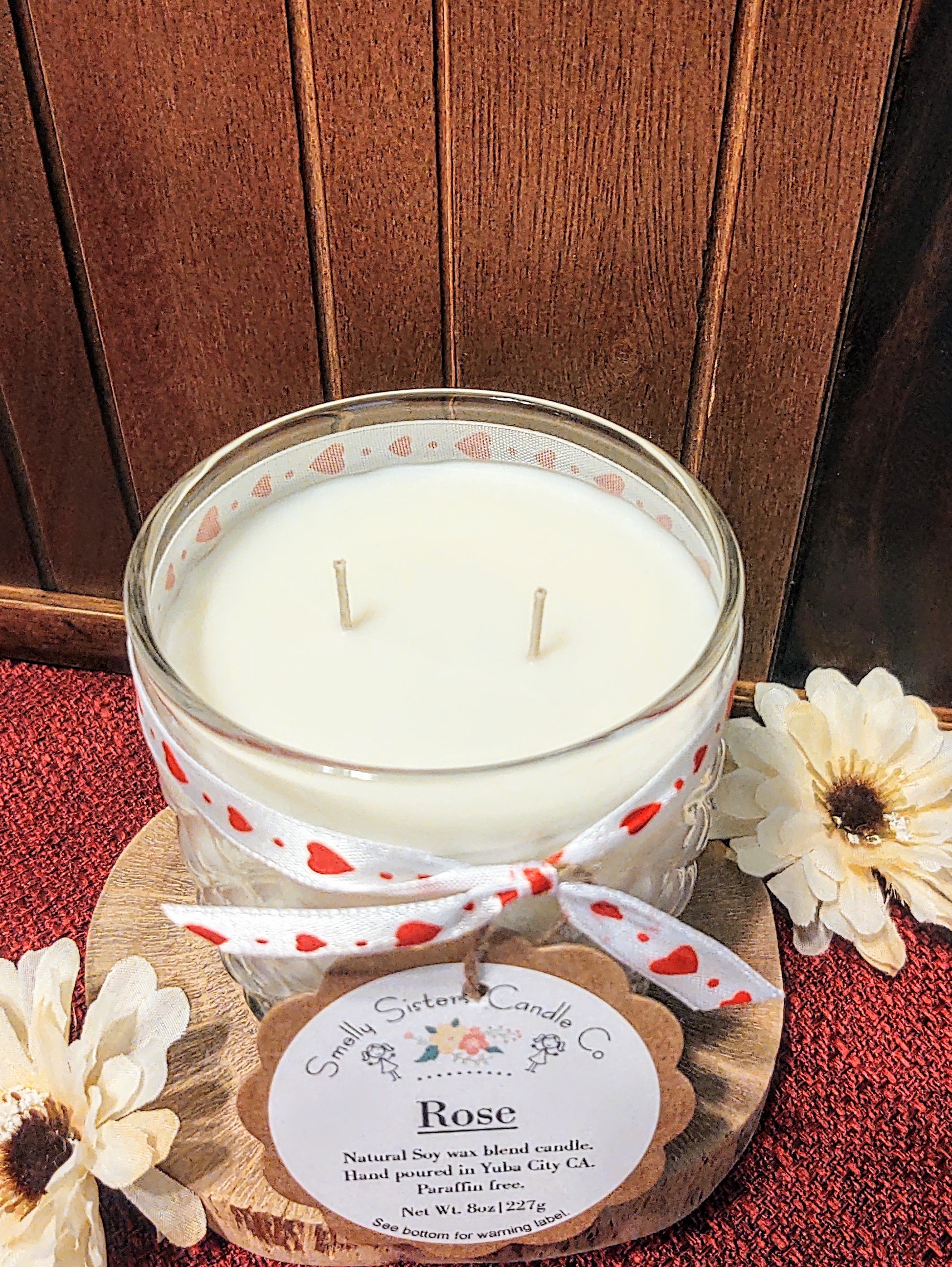 A decorative glass 8oz natural soy wax scented candle with a bronze metal lid. Double wicked with cleaner burning cotton wicks. Paraffin free, phthalate free fragrance infused with essential oils, best rose scent.
