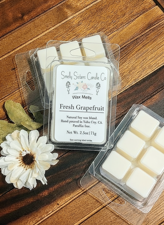 Front view of a package of soy wax melts scented fresh grapefruit. Dye free and Paraffin free. Beeswax. Cleaner.